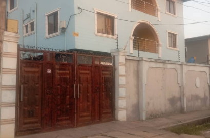 Full plot of land with 9 shops under decken By Grandmate b/stop off Ago palace Way,Okota, Lagos